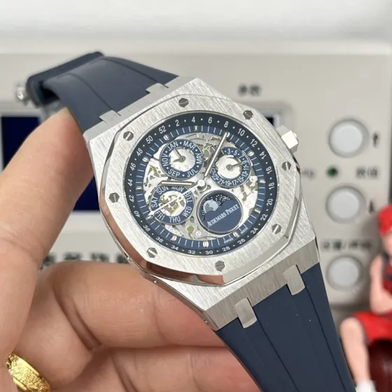 Audemars Piguet Royal Oak Perpetual Calendar Openworked 26574ST OO 1220ST 01 stainless steel case and bezel blue openworked dial blue rubber strap 41mm Men s Automatic